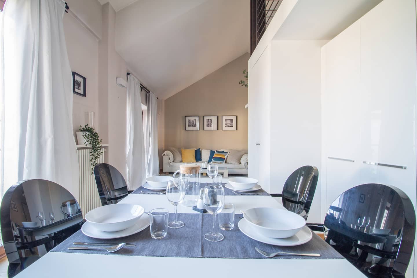 Dining table set in the kitchen of La La Land House, Vayadù flat in Genola