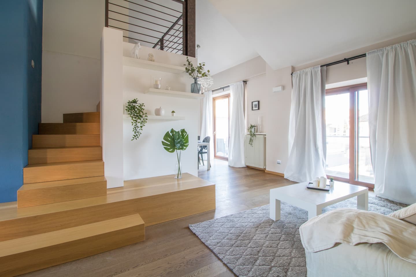 Sofa’s view in the bright living area of La La Land House, Vayadù’s flat in Genola